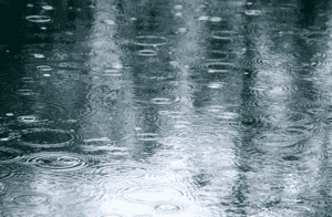 Photo of rain falling in water