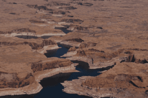 A ring marks the receded shoreline at Lake Powell, a Colorado River reservoir on the Utah-Arizona border that is now 24% full. A record-low snowpack across the Colorado River Basin is heightening concerns as drought conditions in the Southwest worsen.