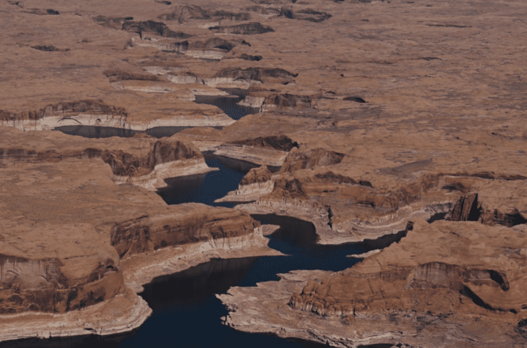 A ring marks the receded shoreline at Lake Powell, a Colorado River reservoir on the Utah-Arizona border that is now 24% full. A record-low snowpack across the Colorado River Basin is heightening concerns as drought conditions in the Southwest worsen.